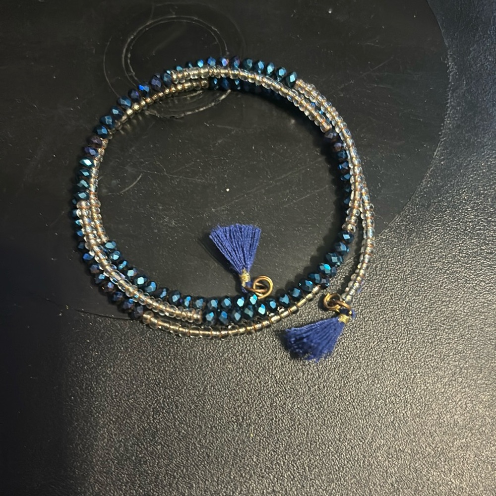 Blue and clear beaded wrap bracelet with tassels